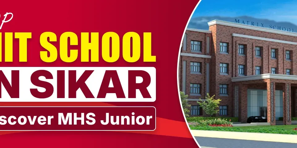 A promotional banner for "Top MIT School in Sikar" featuring a modern red-brick school building labeled "Matrix School." The text highlights "Discover MHS Junior" with bold, yellow and white fonts on a red background, emphasizing the school's prominence in Sikar. The building has multiple windows, a main entrance with pillars, and landscaped greenery with flowers in front.